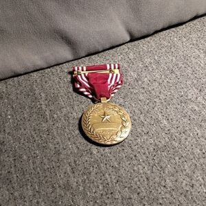 Gold Medal with Red Ribbon